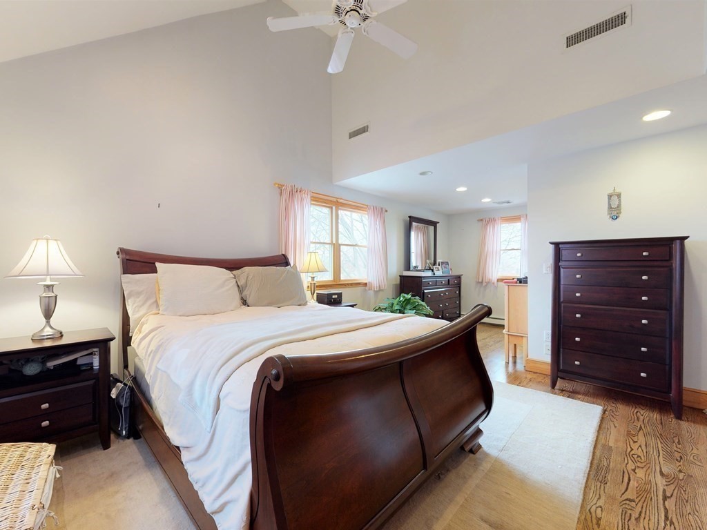 26 Grosvenor Road Waltham, MA 02453 - Photo 13 of 35 a bedroom with a bed and a dresser