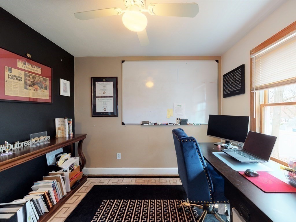 26 Grosvenor Road Waltham, MA 02453 - Photo 19 of 35 a room with furniture and a flat screen tv