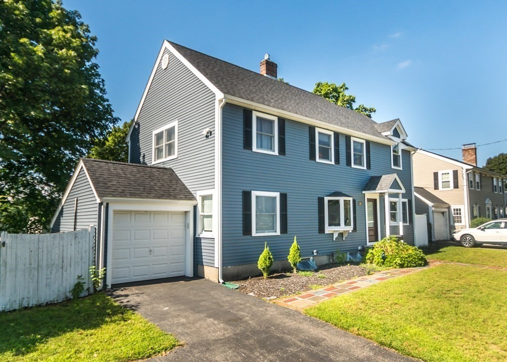 26 Grosvenor Road Waltham, MA 02453 - Photo 2 of 35 a front view of a house with a yard