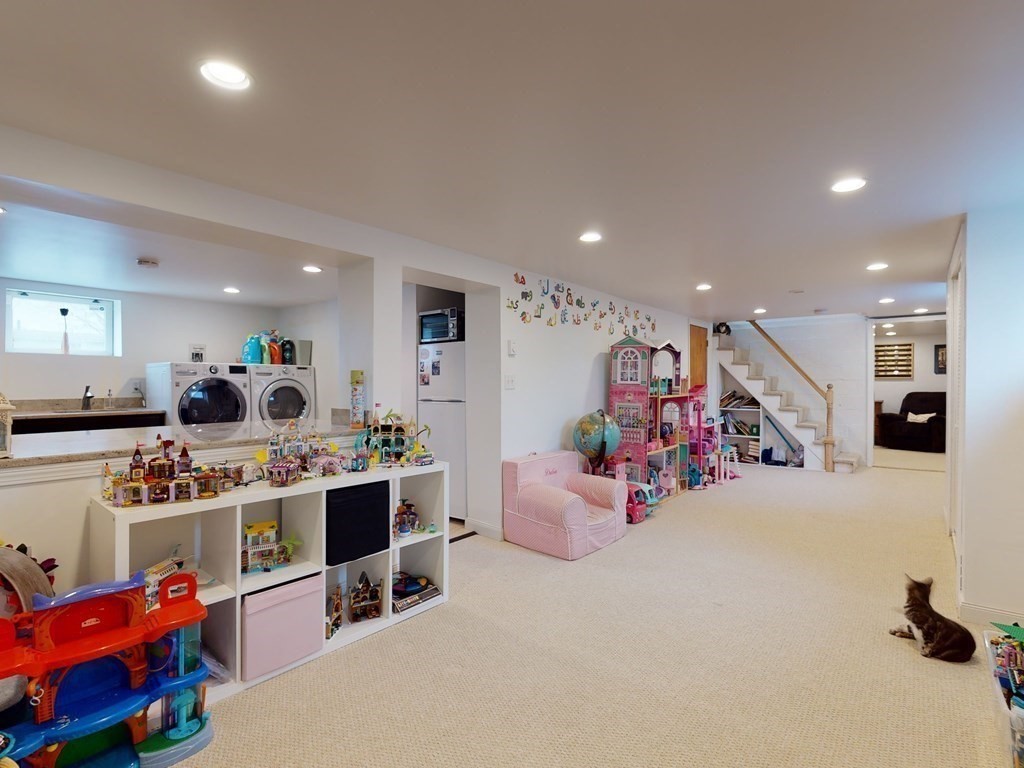 26 Grosvenor Road Waltham, MA 02453 - Photo 21 of 35 a view of a kitchen with furniture and clutter
