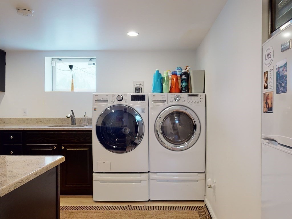 26 Grosvenor Road Waltham, MA 02453 - Photo 24 of 35 a utility room with dryer and washer