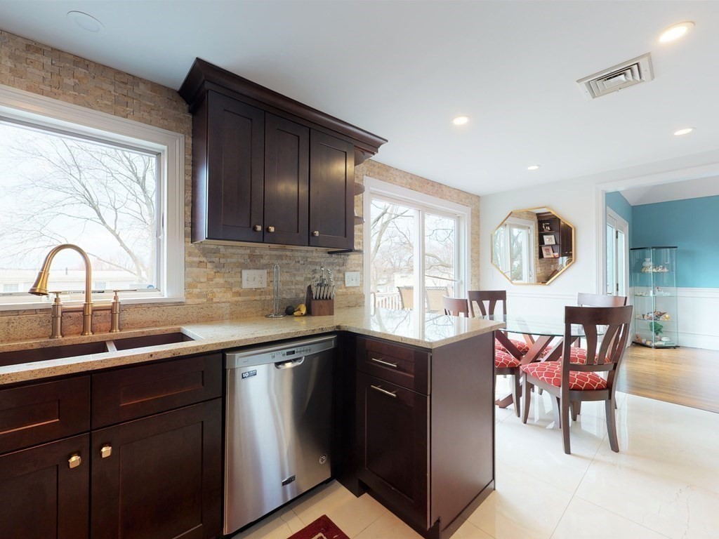 26 Grosvenor Road Waltham, MA 02453 - Photo 6 of 35 a kitchen with a sink and cabinets
