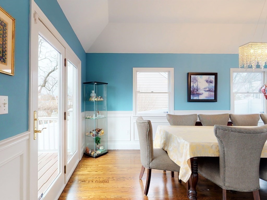 26 Grosvenor Road Waltham, MA 02453 - Photo 8 of 35 a living room with furniture a large window and a table