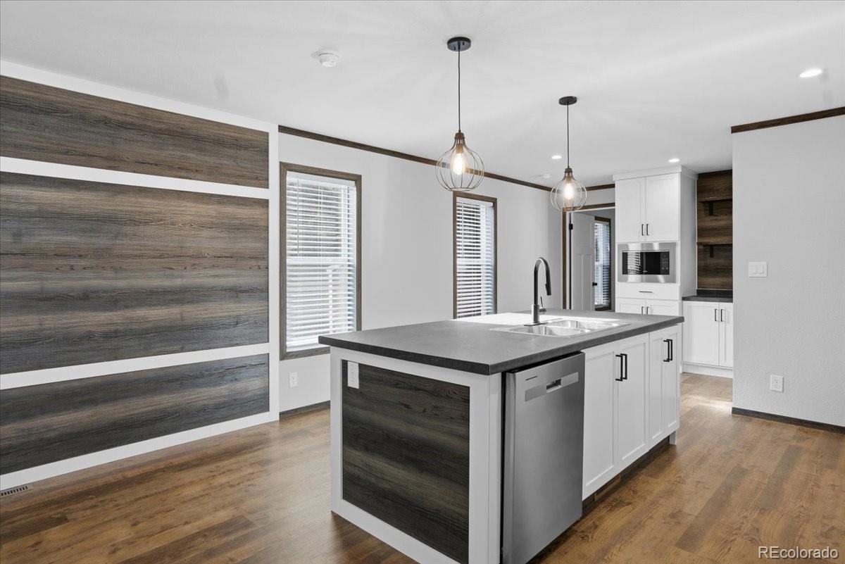 230 North 2nd Berthoud, CO 80513 - Photo 6 of 21 a kitchen with a sink and stove