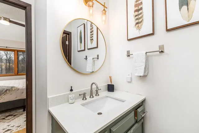 a bathroom with a sink and a mirror