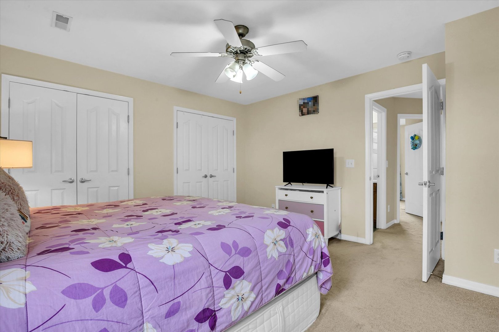 3715 Boulder Ridge Drive Champaign, IL 61822 - Photo 20 of 29 a bedroom with a bed and a flat screen tv