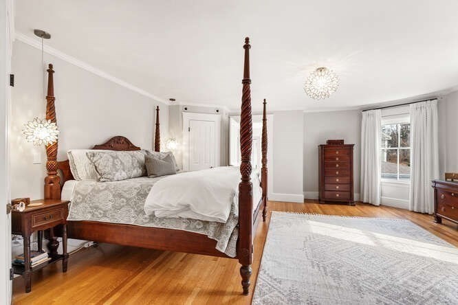 6 Hayes Avenue Lexington, MA 02420 - Photo 16 of 34 a spacious bedroom with a bed window and a table