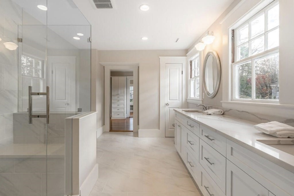 6 Hayes Avenue Lexington, MA 02420 - Photo 17 of 34 a bathroom with a double vanity sink and a mirror