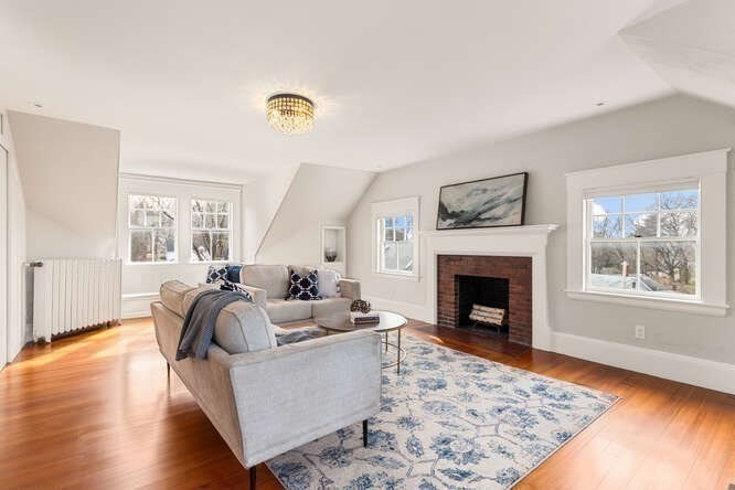 6 Hayes Avenue Lexington, MA 02420 - Photo 29 of 34 a living room with furniture and a fireplace