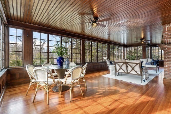 6 Hayes Avenue Lexington, MA 02420 - Photo 3 of 34 a view of a dining room with furniture wooden floor and floor to ceiling windows