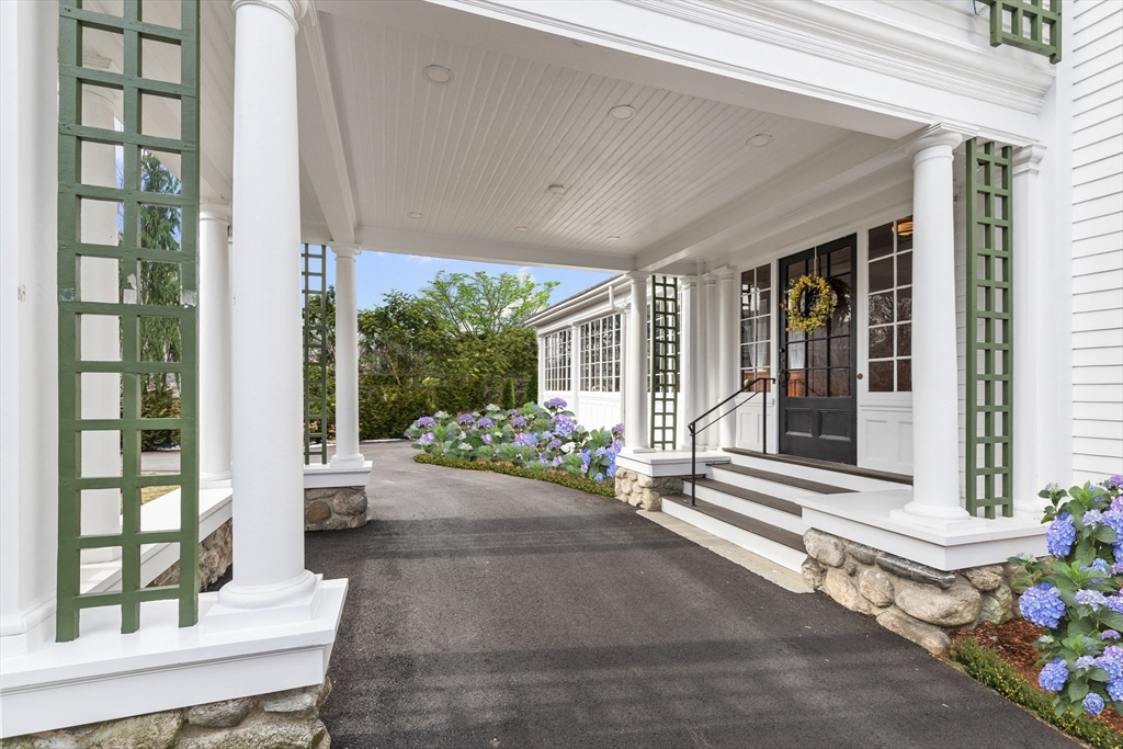 6 Hayes Avenue Lexington, MA 02420 - Photo 34 of 34 a view of a patio with table and chairs and potted plants