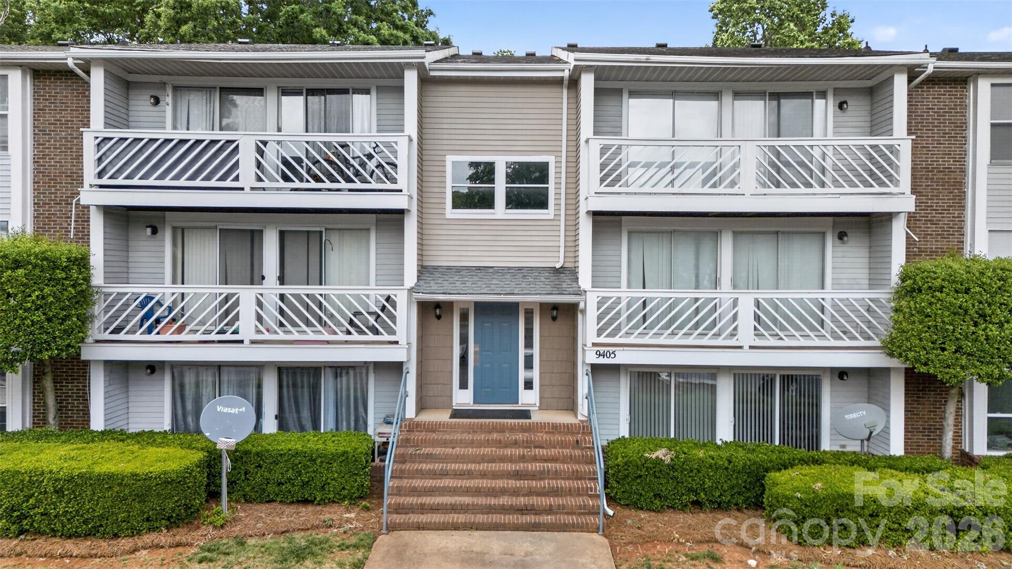 9405 Old Concord Road, Unit C Charlotte, NC 28213 - Photo 1 of 27 a front view of a house with a garden