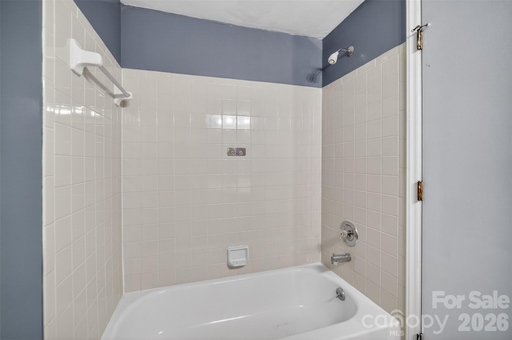 9405 Old Concord Road, Unit C Charlotte, NC 28213 - Photo 17 of 27 a bathroom with a white bath tub
