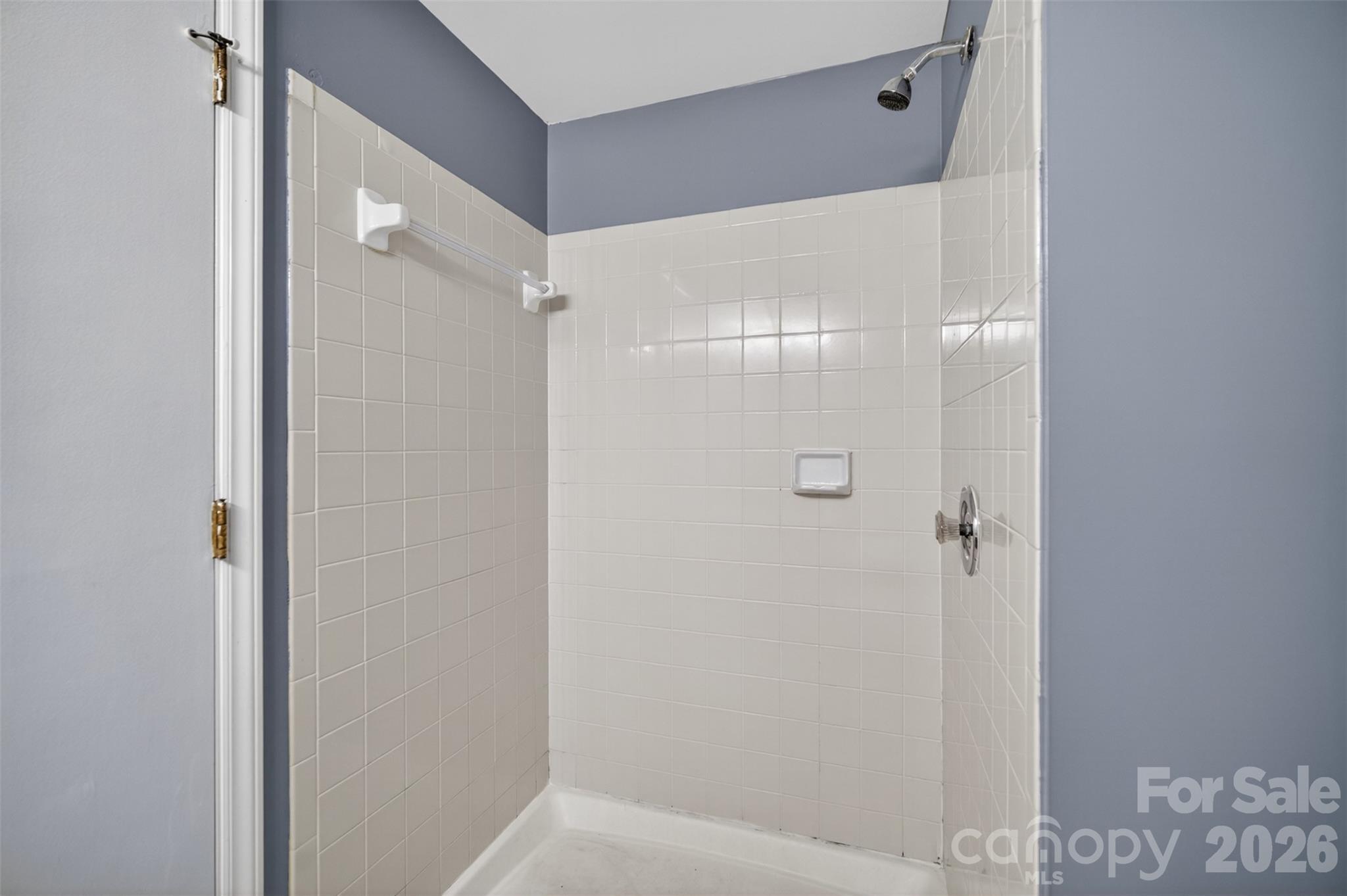 9405 Old Concord Road, Unit C Charlotte, NC 28213 - Photo 22 of 27 a bathroom with a glass shower door