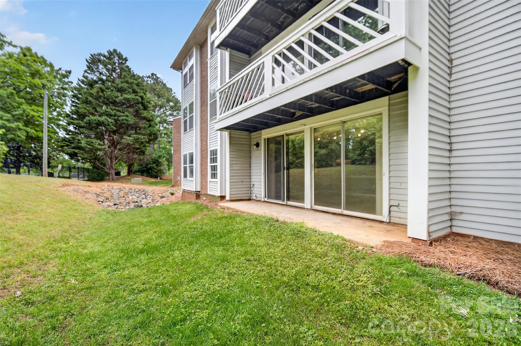 9405 Old Concord Road, Unit C Charlotte, NC 28213 - Photo 23 of 27 a front view of a house with a yard
