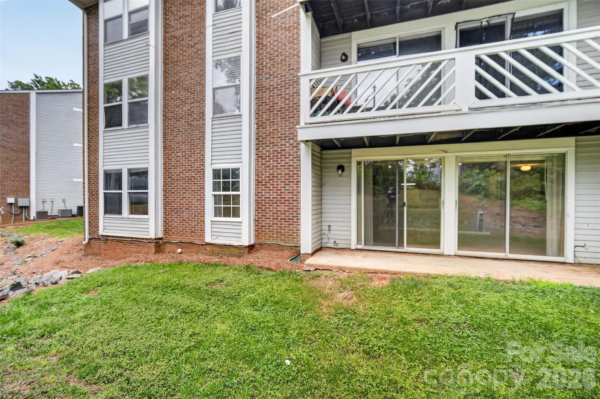 9405 Old Concord Road, Unit C Charlotte, NC 28213 - Photo 24 of 27 front view of a building with a garden