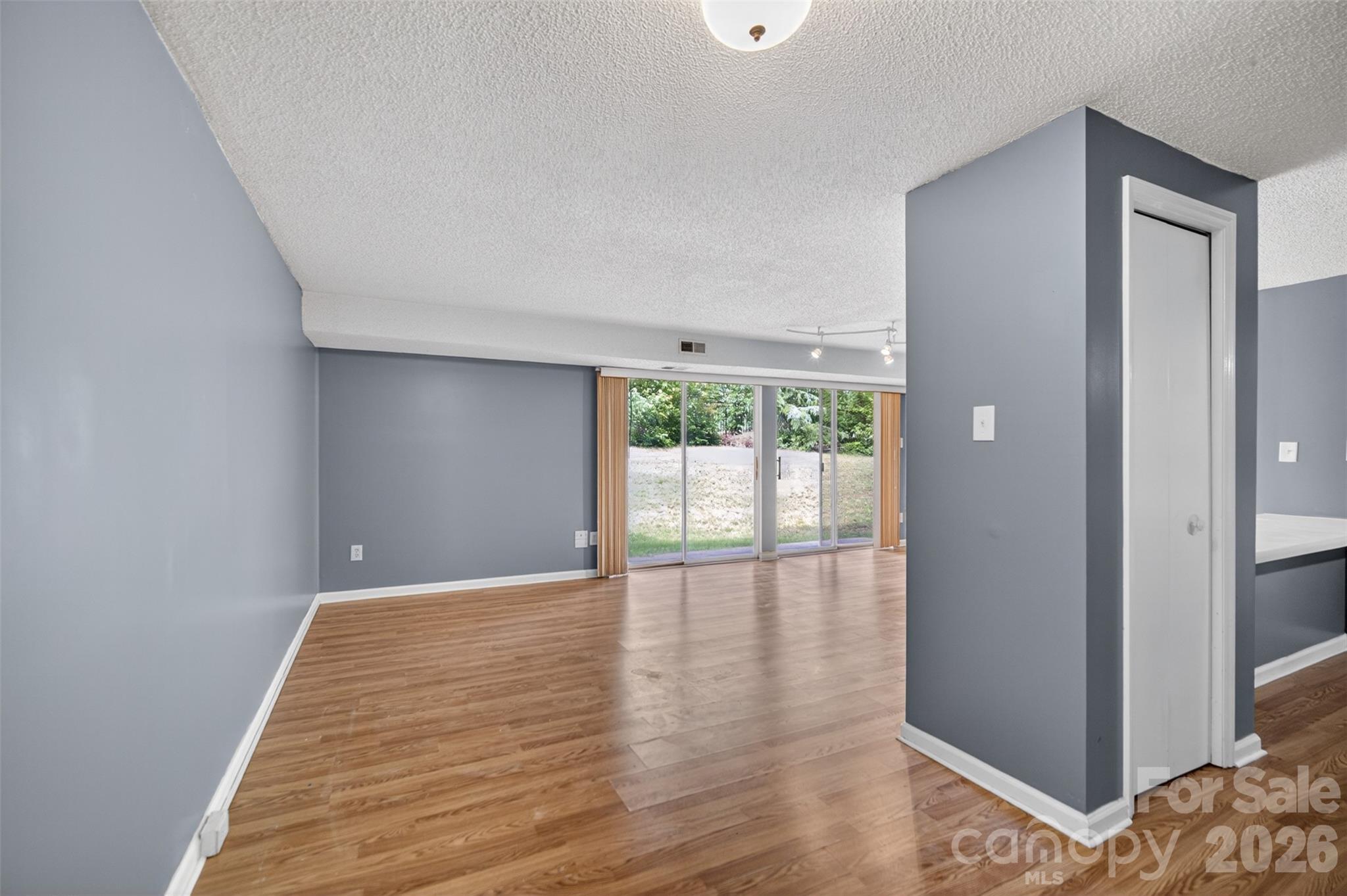 9405 Old Concord Road, Unit C Charlotte, NC 28213 - Photo 3 of 27 a view of an empty room and window