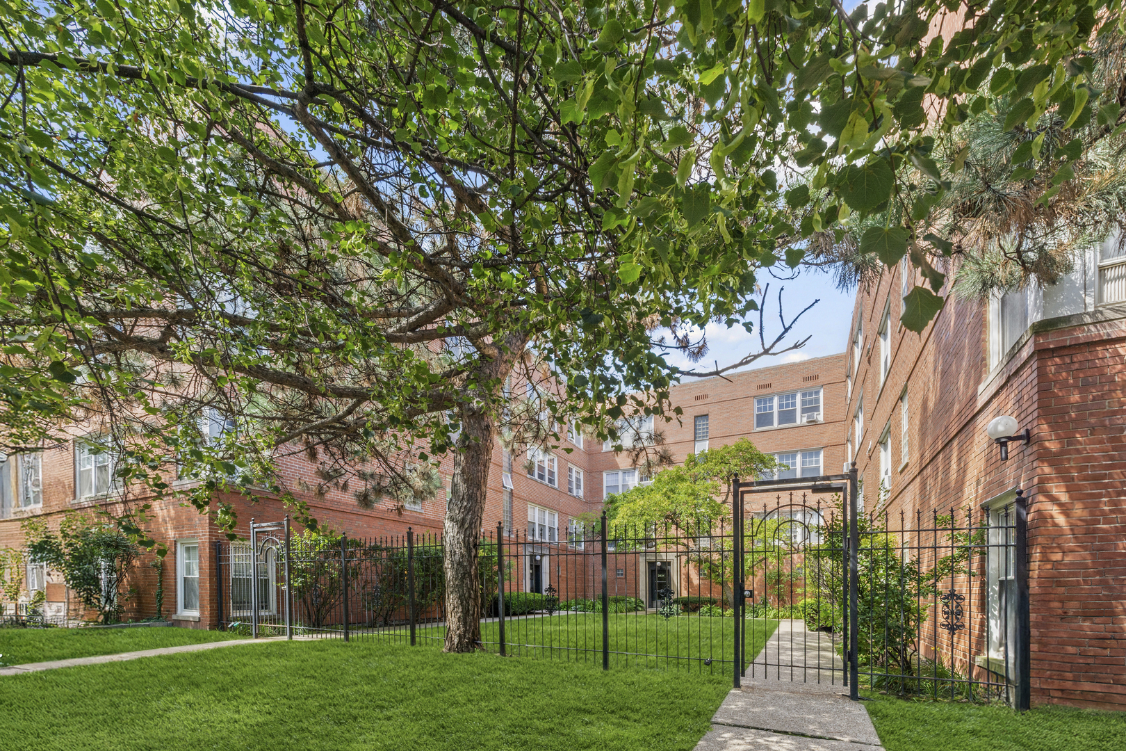 2434 West Farragut Avenue, Unit 3B Chicago, IL 60625 - Photo 1 of 20 a view of a park with large trees