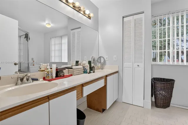 a kitchen with a sink and a refrigerator