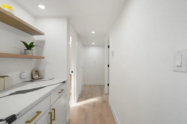 a bathroom with a shower and a sink