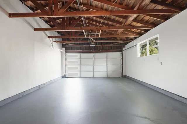a view of a room with wooden walls