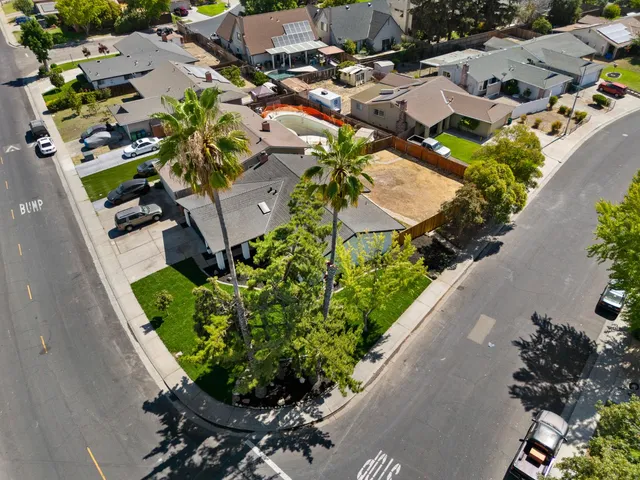 an aerial view of a house with a garden and plants
