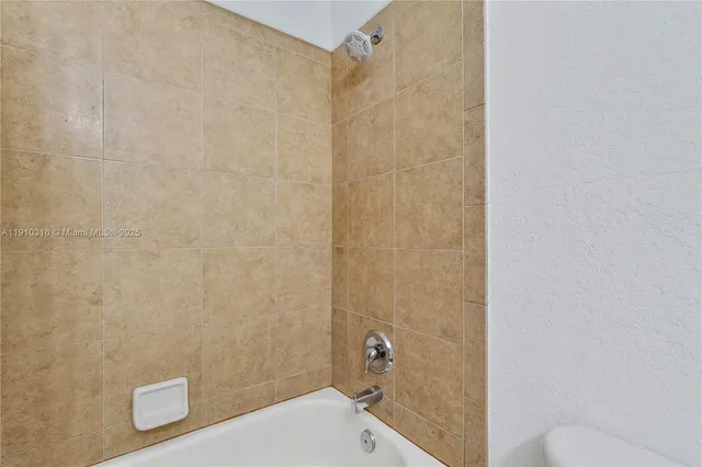 a bathroom with a shower and a toilet