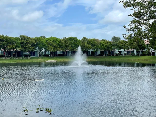 a view of a lake and green space