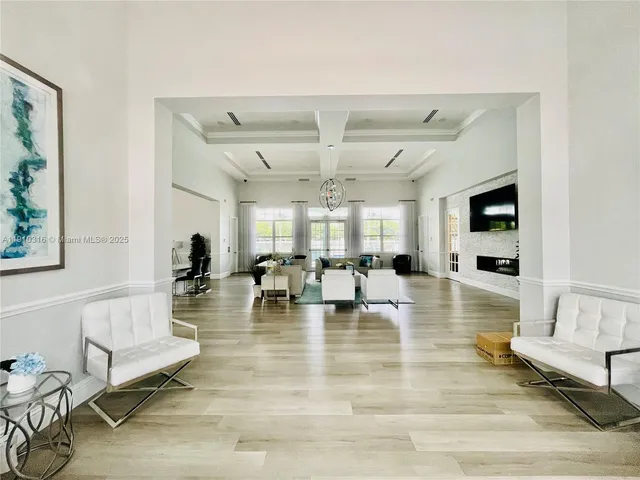 a living room with fireplace furniture and a flat screen tv