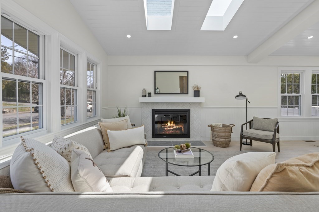 14 Colgate Road Marblehead, MA 01945 - Photo 2 of 35 a living room with furniture and a fireplace