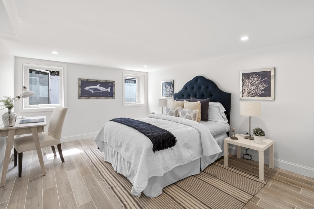 14 Colgate Road Marblehead, MA 01945 - Photo 27 of 35 a bedroom with a bed and wooden floor