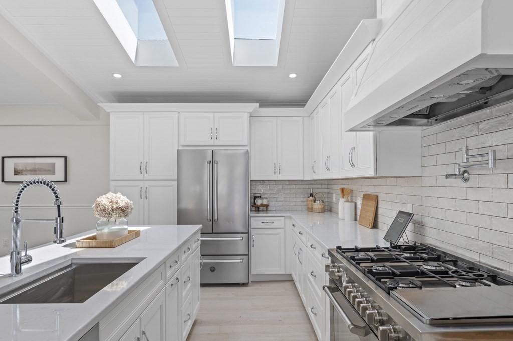 14 Colgate Road Marblehead, MA 01945 - Photo 6 of 35 a kitchen with stainless steel appliances a sink a stove and a refrigerator