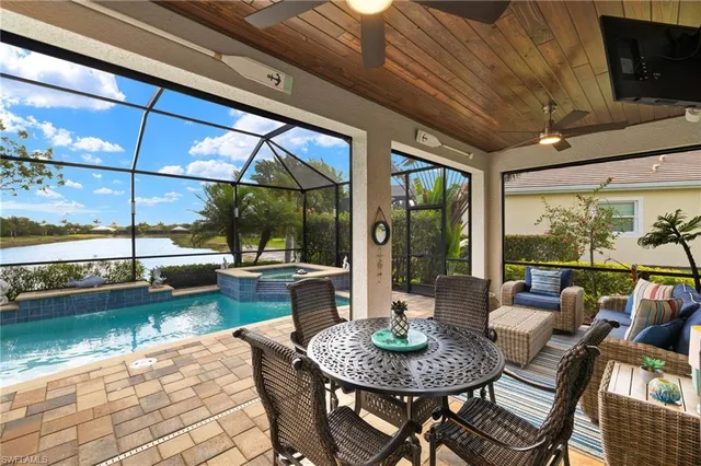 a view of a patio with swimming pool table and chairs