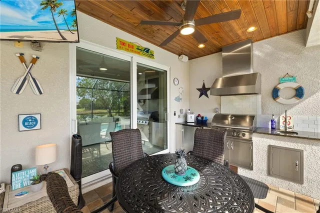 a swimming pool with outdoor seating and yard