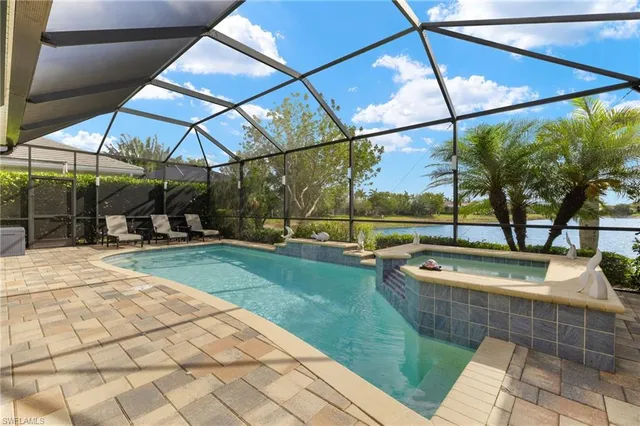 a view of a house with a yard and plants