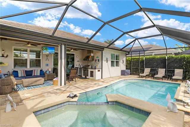 a aerial view of a house with a yard and a garden