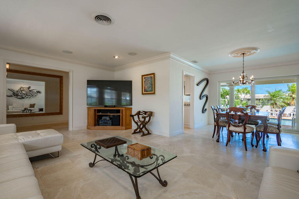 4450 Northeast 24th Terrace Lighthouse Point, FL 33064 - Photo 11 of 47 a living room with furniture and a wooden floor