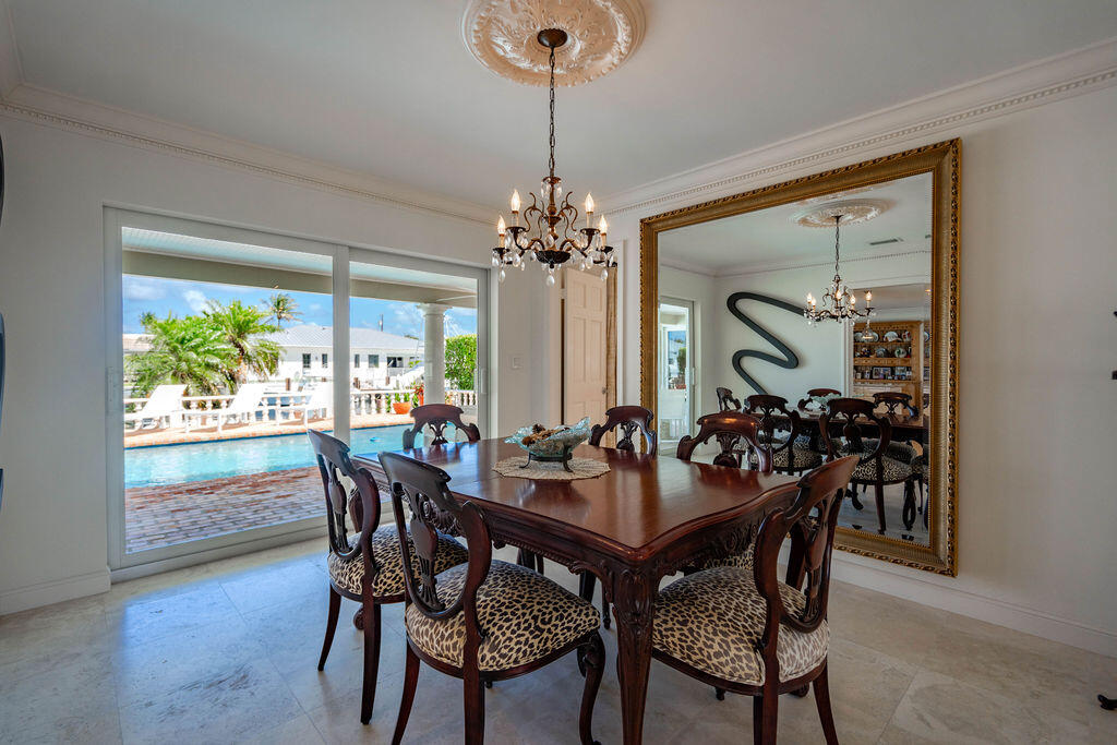 4450 Northeast 24th Terrace Lighthouse Point, FL 33064 - Photo 12 of 47 a view of a dining room with furniture window and outside view
