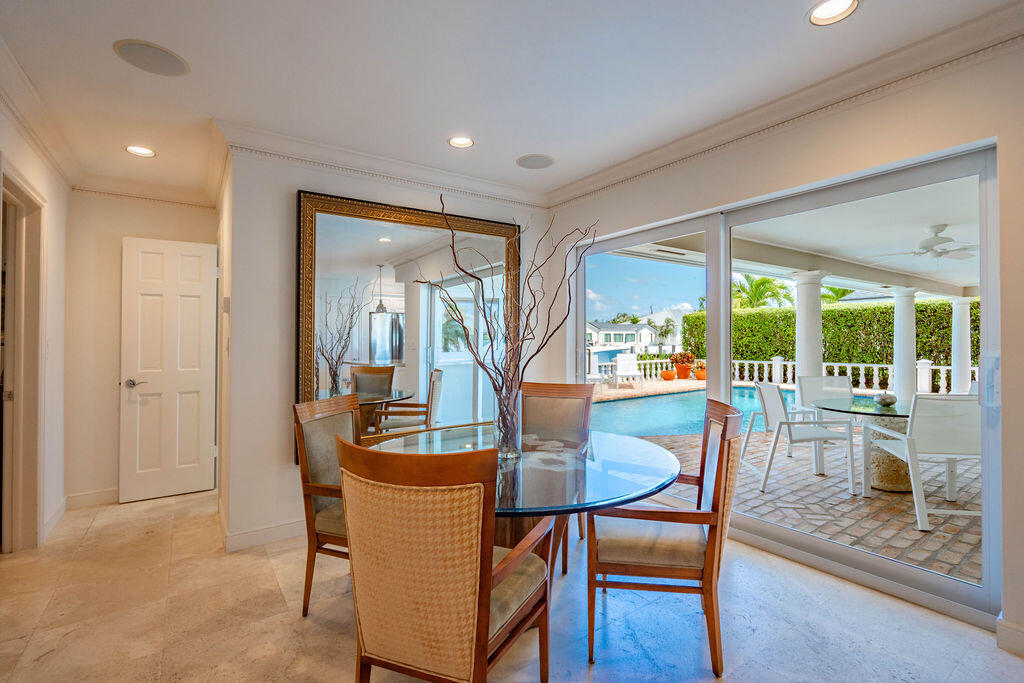 4450 Northeast 24th Terrace Lighthouse Point, FL 33064 - Photo 18 of 47 a dining room with furniture window and outside view