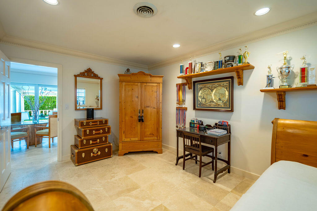 4450 Northeast 24th Terrace Lighthouse Point, FL 33064 - Photo 24 of 47 a living room with furniture and a flat screen tv