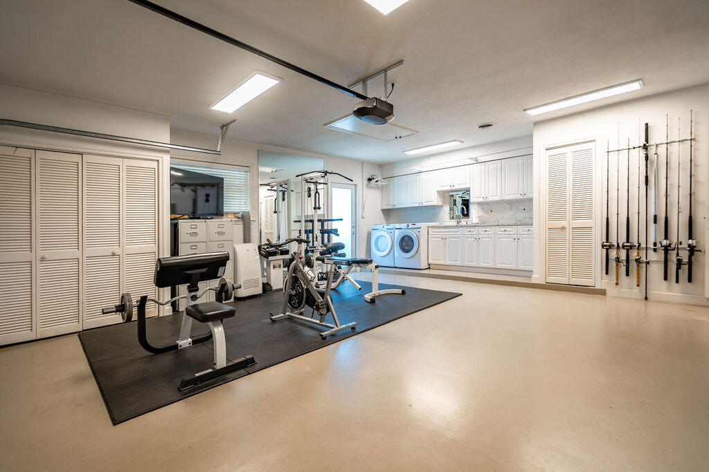 4450 Northeast 24th Terrace Lighthouse Point, FL 33064 - Photo 29 of 47 a view of a room with gym equipment