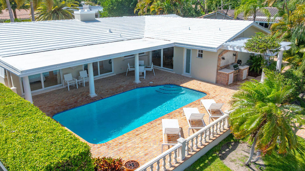 4450 Northeast 24th Terrace Lighthouse Point, FL 33064 - Photo 33 of 47 a view of house with swimming pool outdoor seating area
