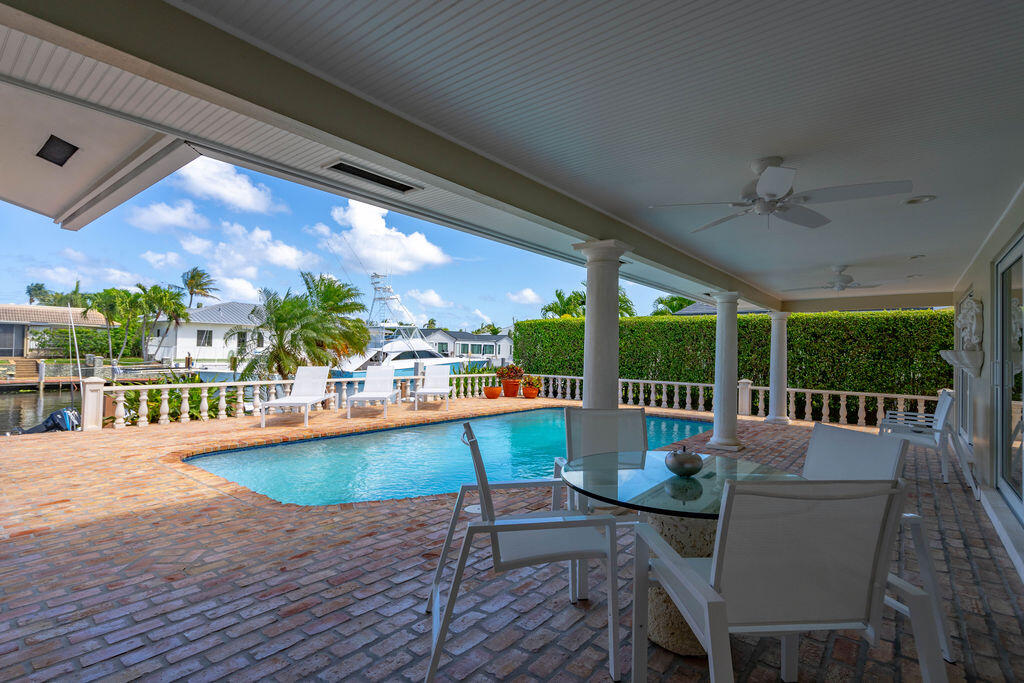 4450 Northeast 24th Terrace Lighthouse Point, FL 33064 - Photo 34 of 47 a view of a patio with swimming pool