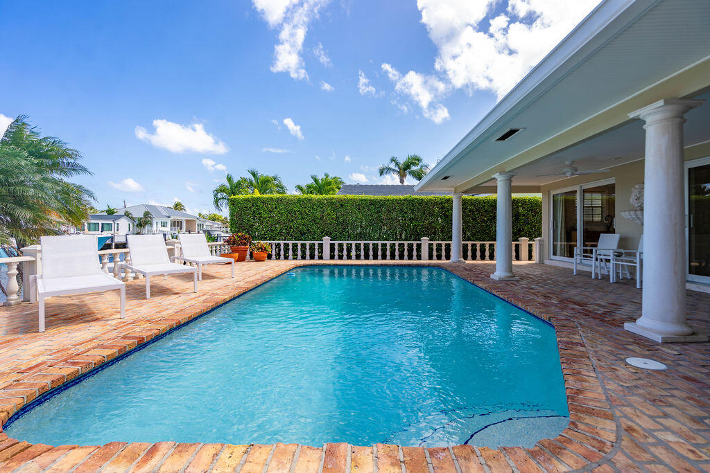 4450 Northeast 24th Terrace Lighthouse Point, FL 33064 - Photo 35 of 47 a view of a house with a swimming pool