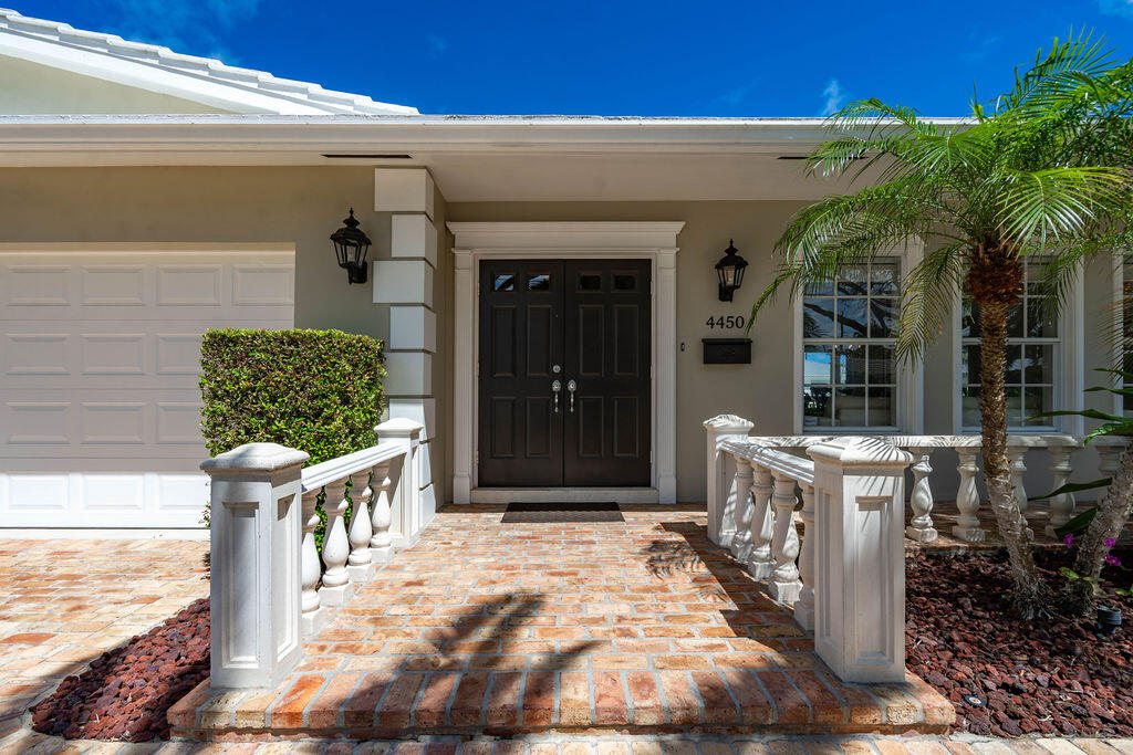 4450 Northeast 24th Terrace Lighthouse Point, FL 33064 - Photo 7 of 47 a view of a entryway door front of house