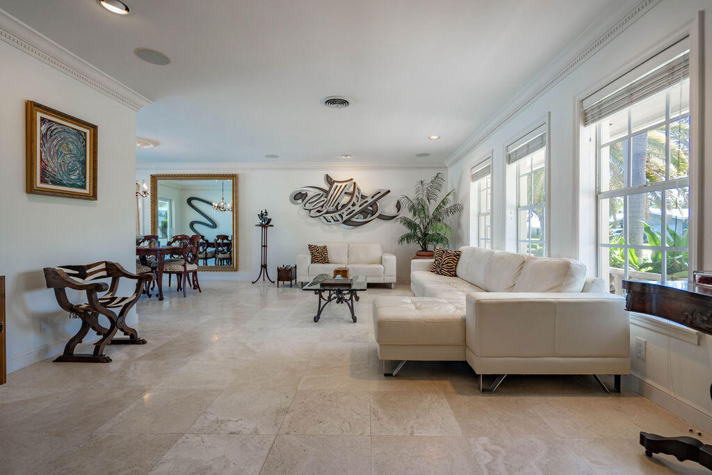 4450 Northeast 24th Terrace Lighthouse Point, FL 33064 - Photo 10 of 47 a living room with furniture and a large window