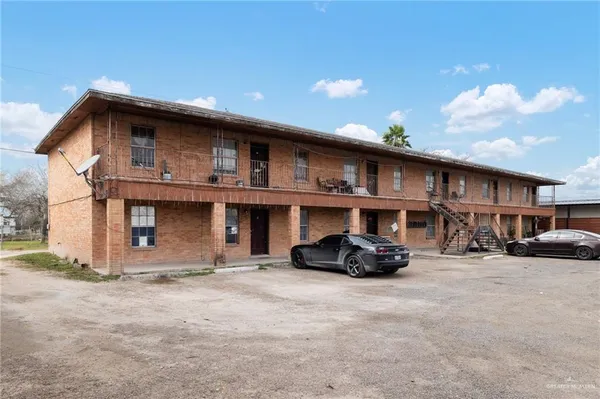 a front view of a house with parking