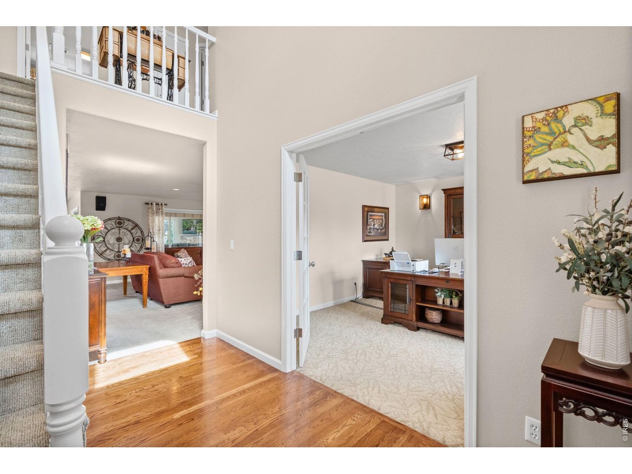 6345 Lesser Drive Greeley, CO 80634 - Photo 12 of 47 Two-story foyer with hardwood flooring