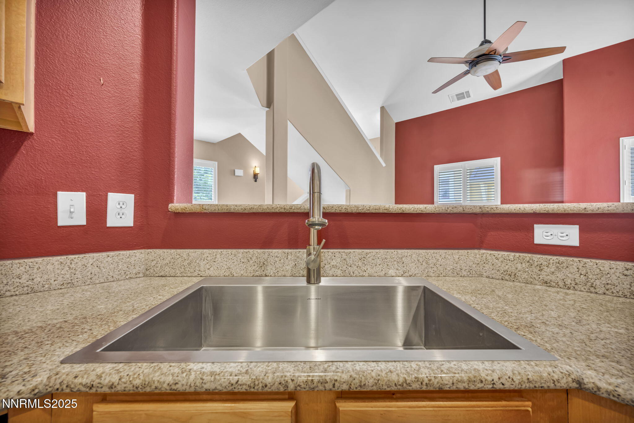 9050 Double R Boulevard, Unit 1123 Reno, NV 89521 - Photo 22 of 39 a kitchen with kitchen island granite countertop a sink and granite counter tops