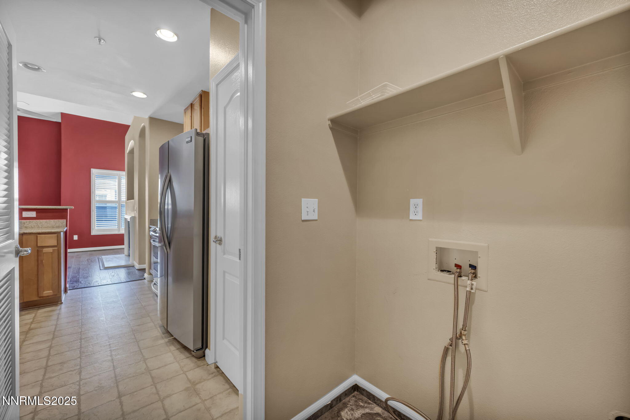 9050 Double R Boulevard, Unit 1123 Reno, NV 89521 - Photo 24 of 39 a view of a hallway with a living room